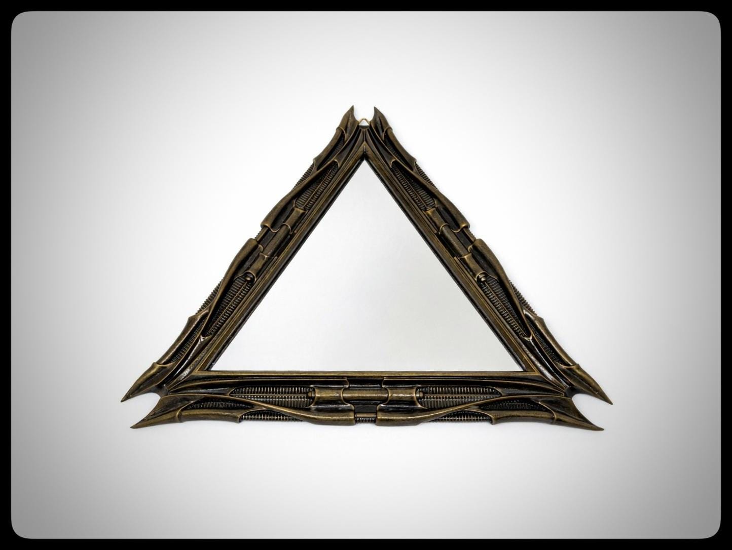 Inspired by H.R. Giger -Mirror Triangular 1983 H 11.02" (28 cm/280 mm) W 12.99" (33 cm/330 mm)